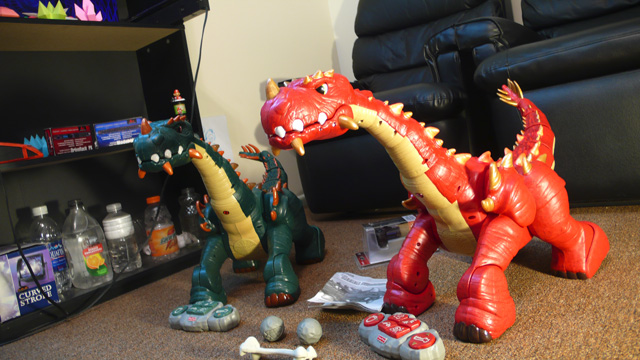 Two 'Spike the Ultra Dinosaur' toys in Admiral Potato's front room