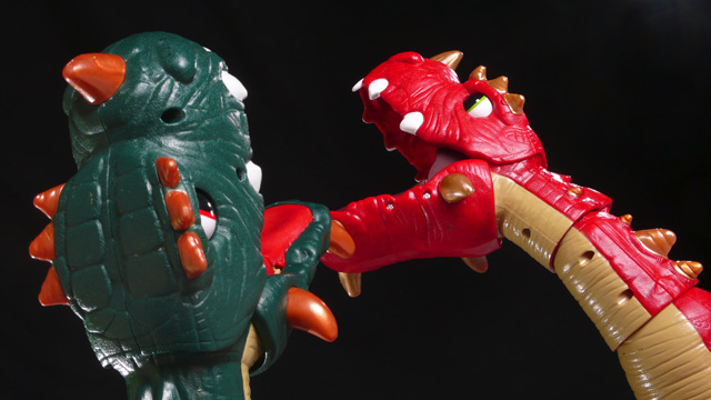 An epic battle between two 3 foot tall toy dinosaurs! Oh, the carnage! Oh, the violence!